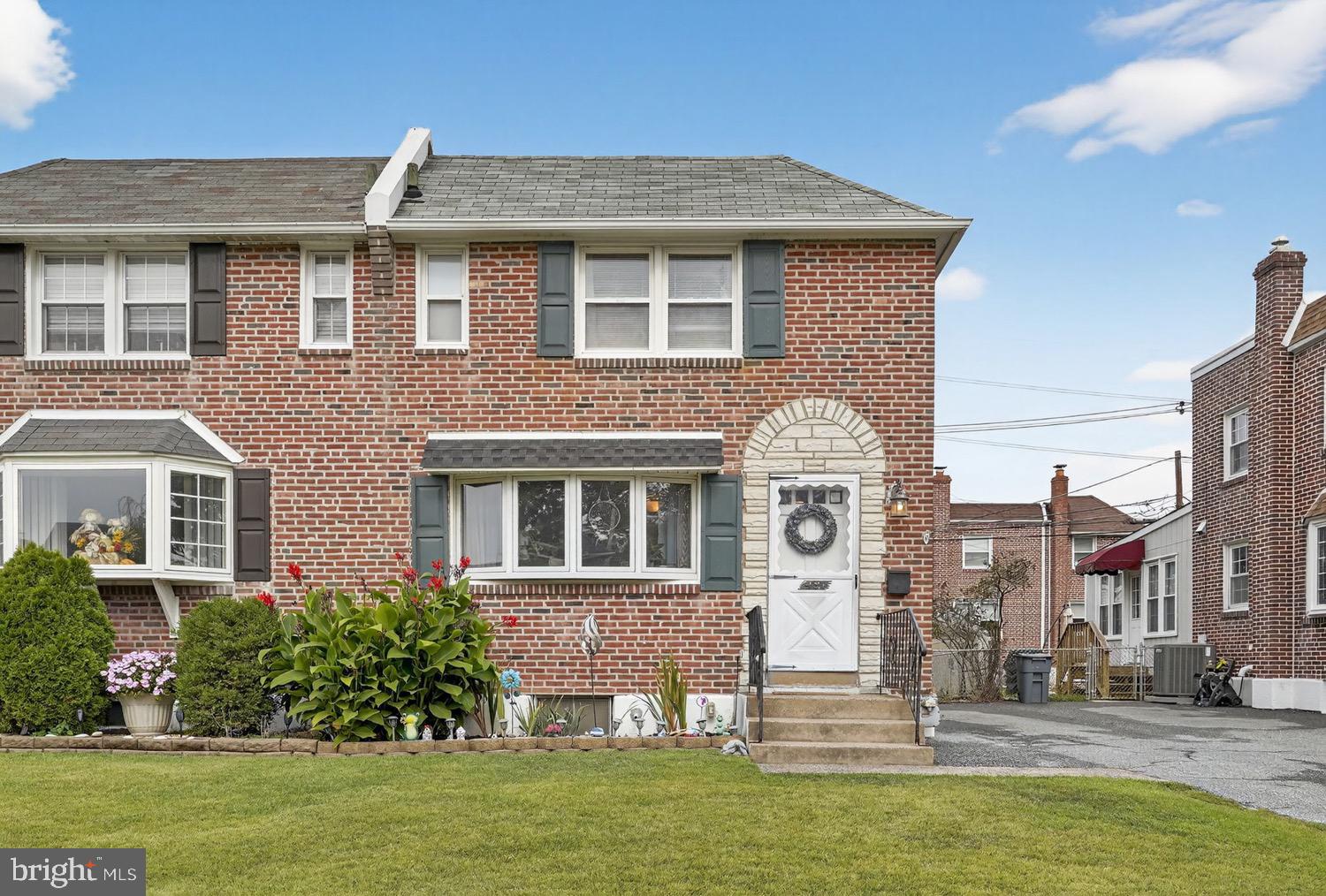 431 East Rodgers Street Ridley Park, PA 19078 - Photo 1 of 21 Charming brick twin with inviting entrance.