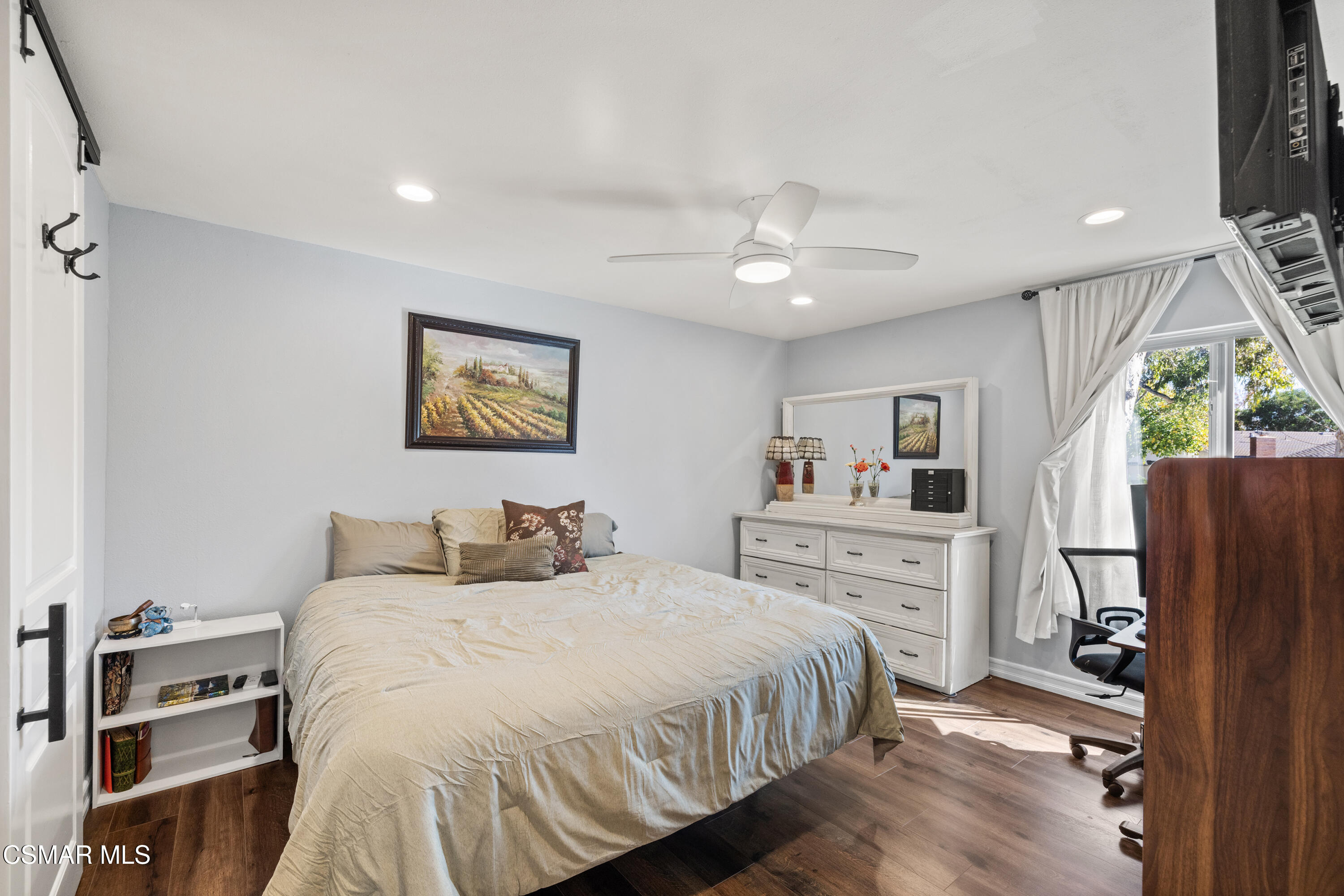 2225 Edelweiss Street, Unit 43 Oxnard, CA 93036 - Photo 12 of 26 a bedroom with a large bed and a window