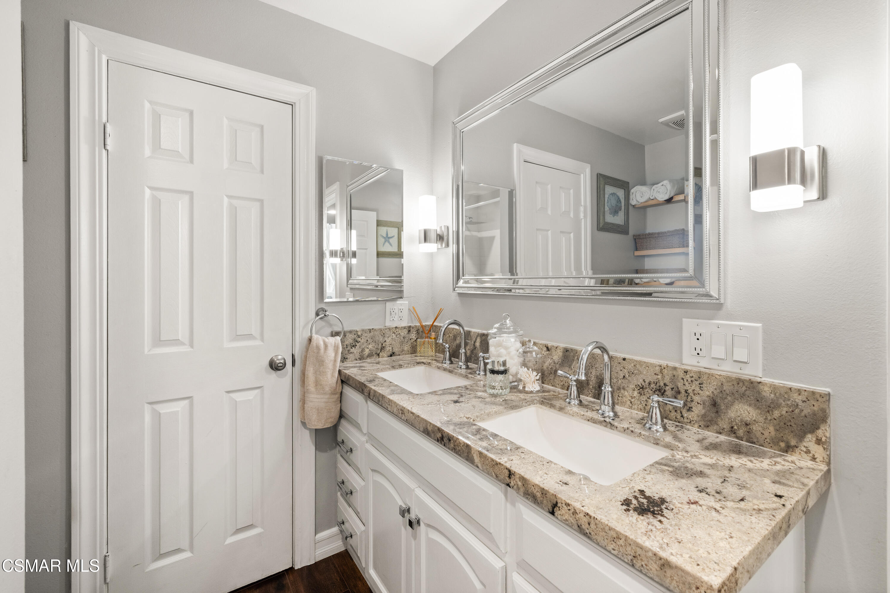 2225 Edelweiss Street, Unit 43 Oxnard, CA 93036 - Photo 15 of 26 a bathroom with a granite countertop sink and a mirror