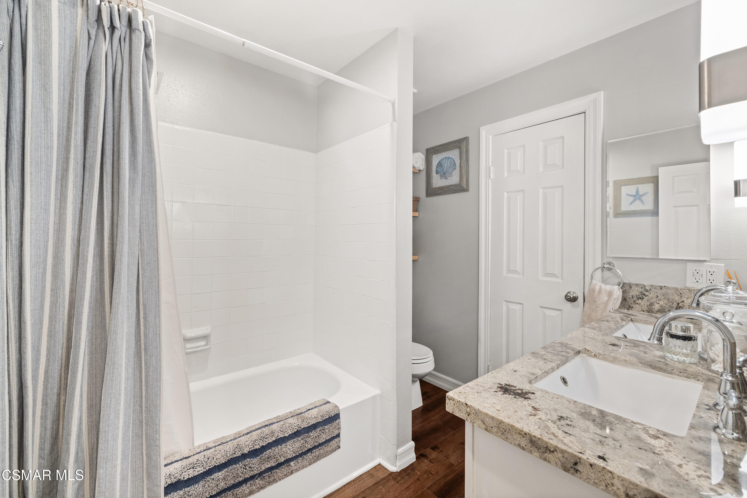 2225 Edelweiss Street, Unit 43 Oxnard, CA 93036 - Photo 16 of 26 a bathroom with a granite countertop sink and a mirror
