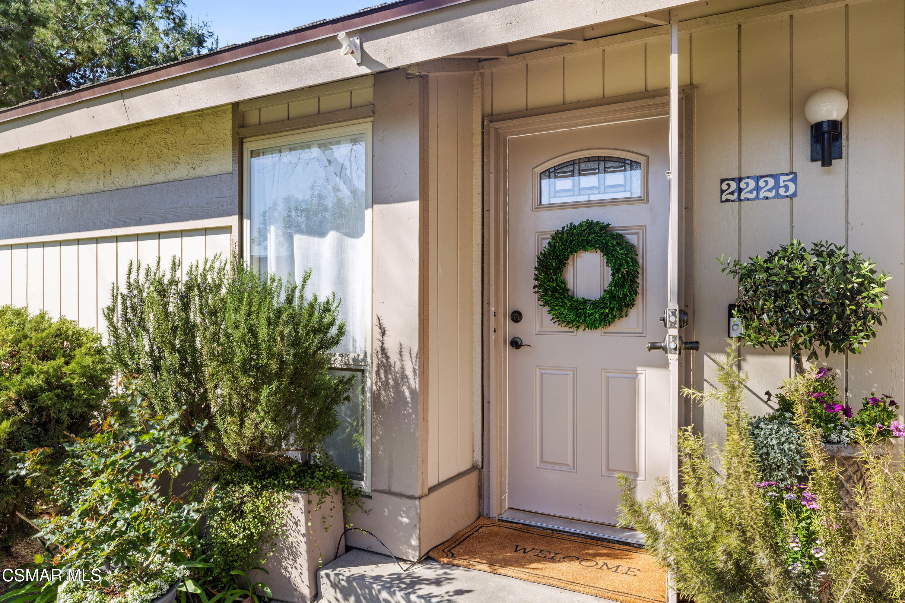 2225 Edelweiss Street, Unit 43 Oxnard, CA 93036 - Photo 3 of 26 a front view of a house with garden