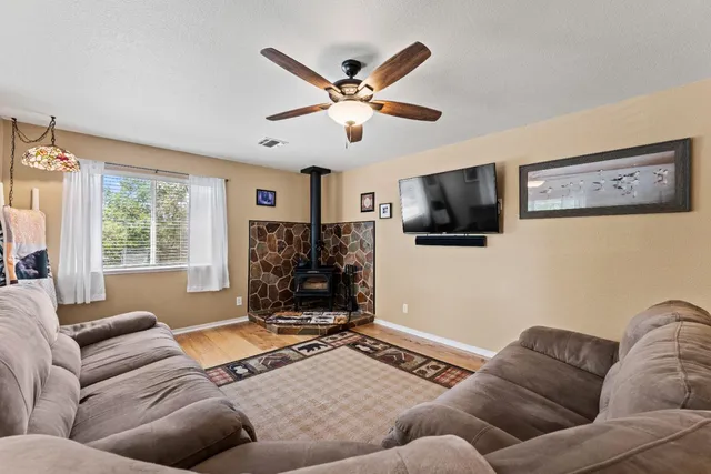 a kitchen with stainless steel appliances granite countertop a stove sink and cabinets