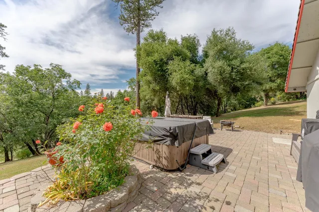 an outdoor space with furniture and umbrella