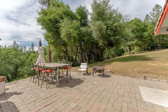 a view of a swimming pool with a patio