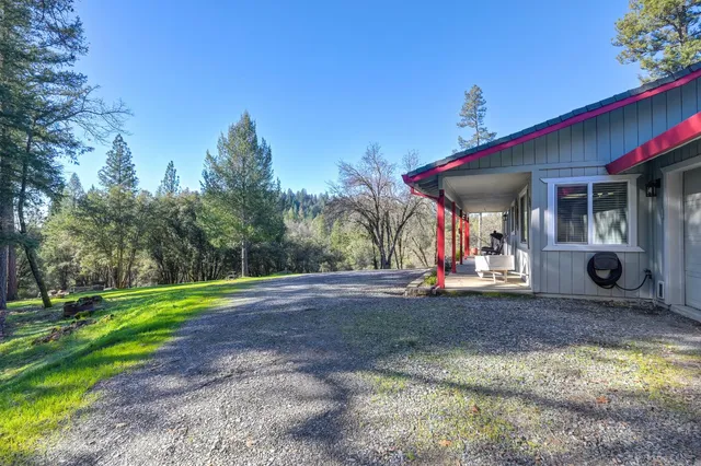a view of a swimming pool with sitting area