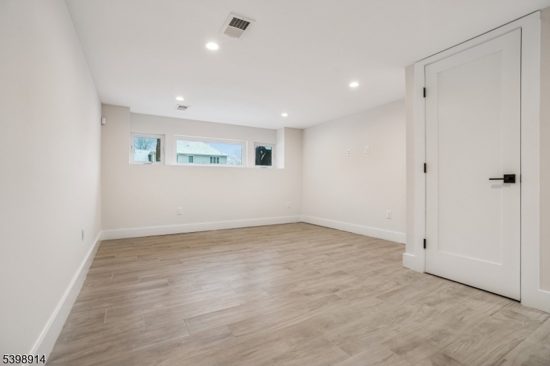 30 Hemlock Terrace Springfield, NJ 07081 - Photo 19 of 22 wooden floor in an empty room with a window