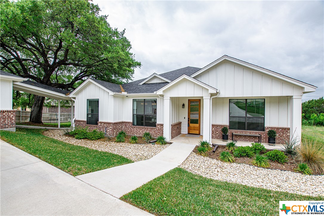2185 Bowles Ranch Road Belton, TX 76513 - Photo 1 of 1 a front view of a house with a yard and porch