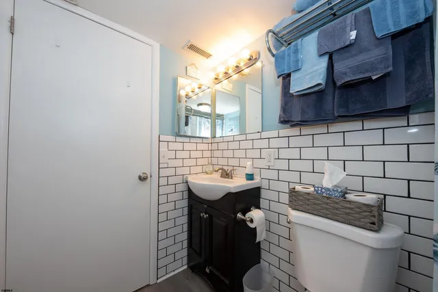 a bedroom with a bed and a closet