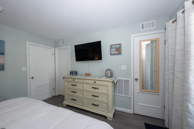 a view of a wooden chairs in a balcony