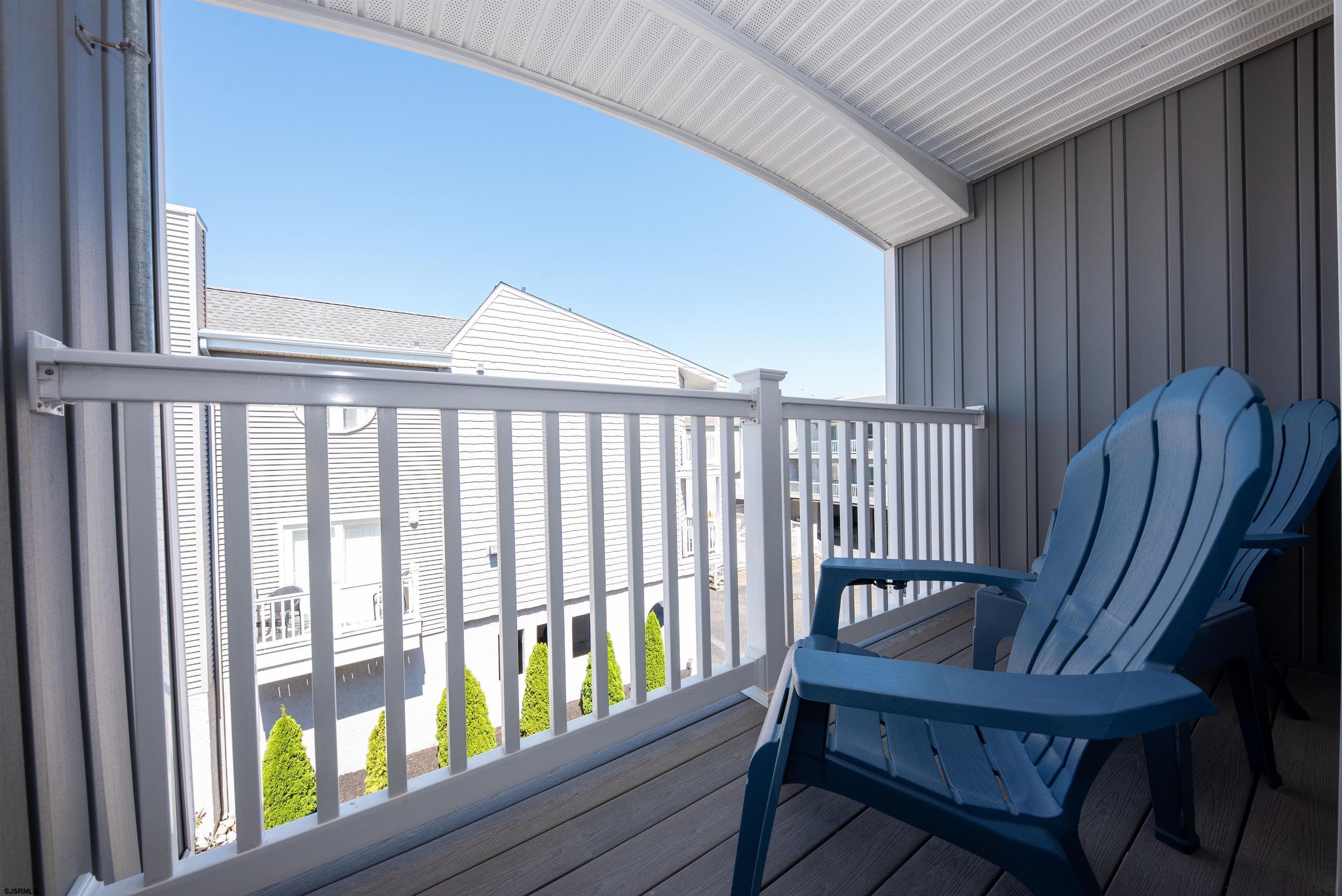 875 Plymouth Place, Unit 35 Ocean City, NJ 08226 - Photo 29 of 60 a view of a two chairs in the balcony