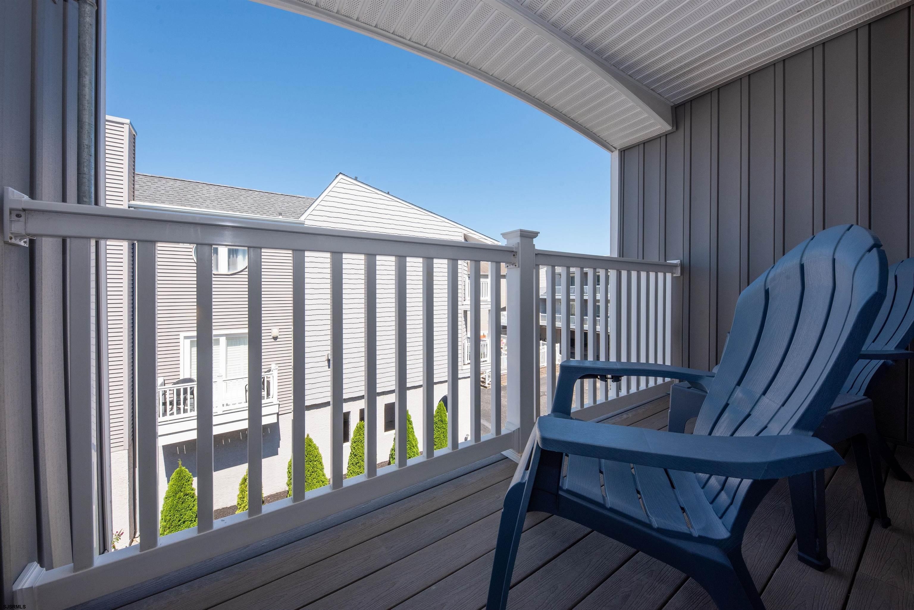 875 Plymouth Place, Unit 35 Ocean City, NJ 08226 - Photo 30 of 60 a view of a wooden chairs in a balcony