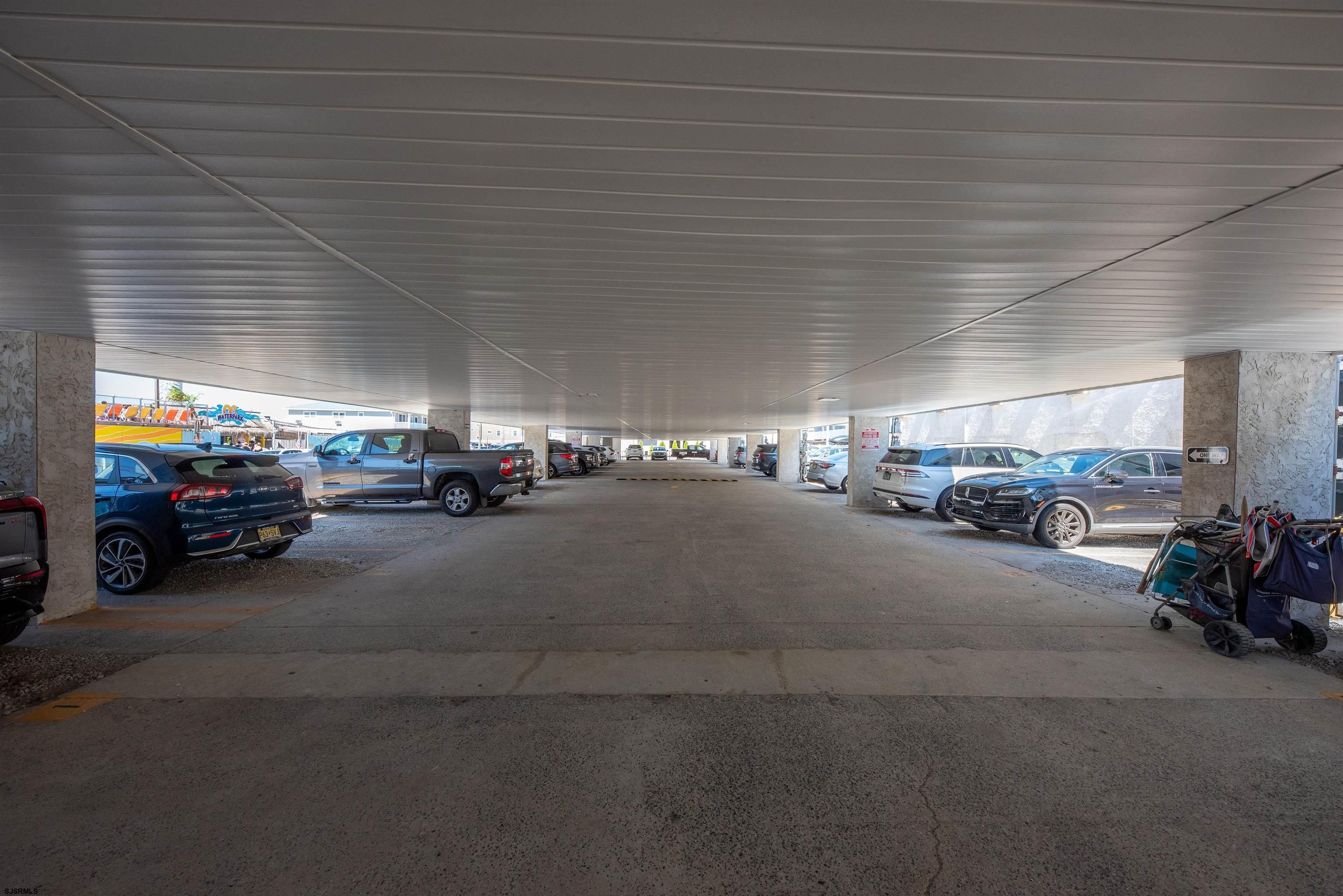 875 Plymouth Place, Unit 35 Ocean City, NJ 08226 - Photo 3 of 60 a view of parking space with parked cars