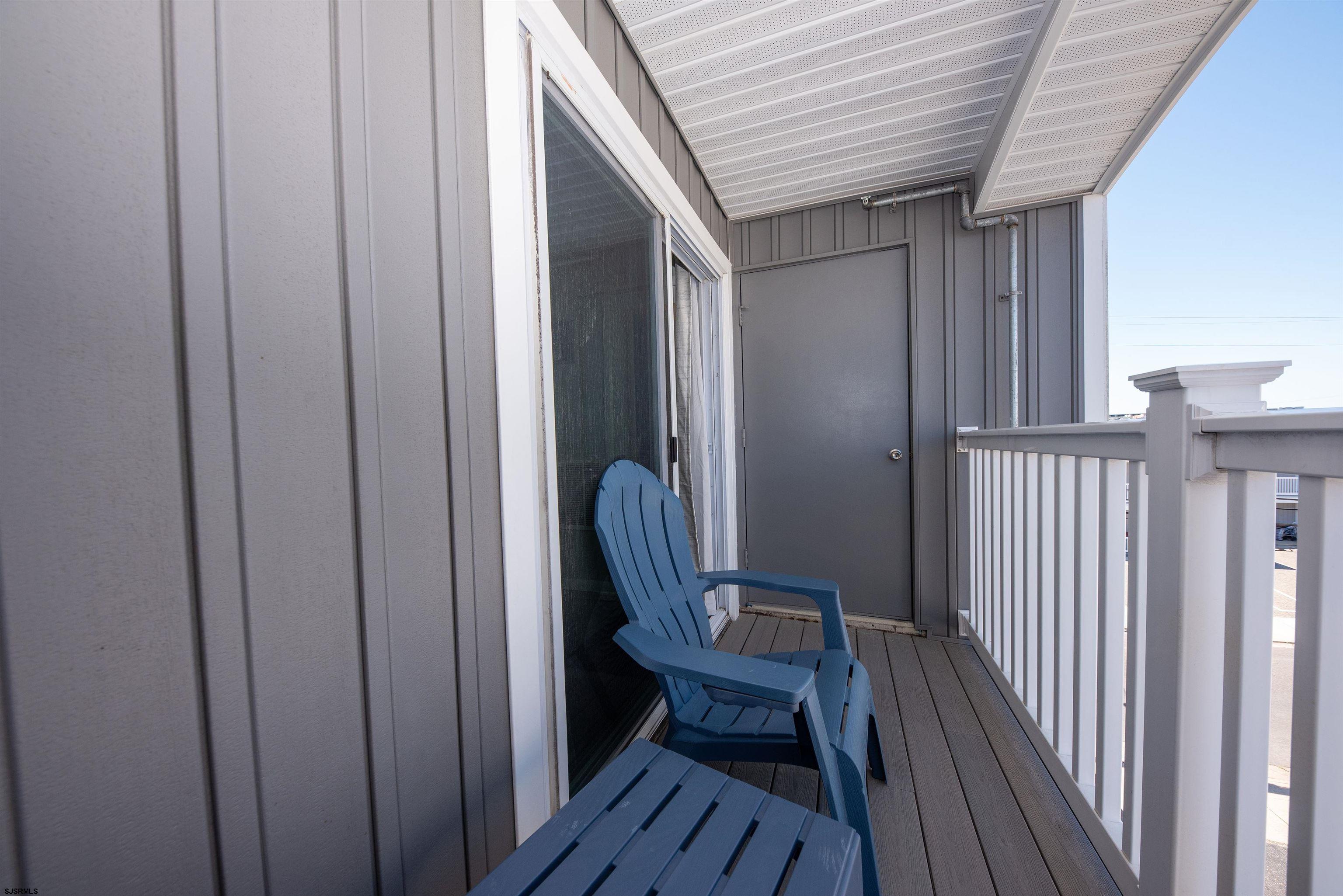 875 Plymouth Place, Unit 35 Ocean City, NJ 08226 - Photo 32 of 60 a view of a wooden chairs in a balcony