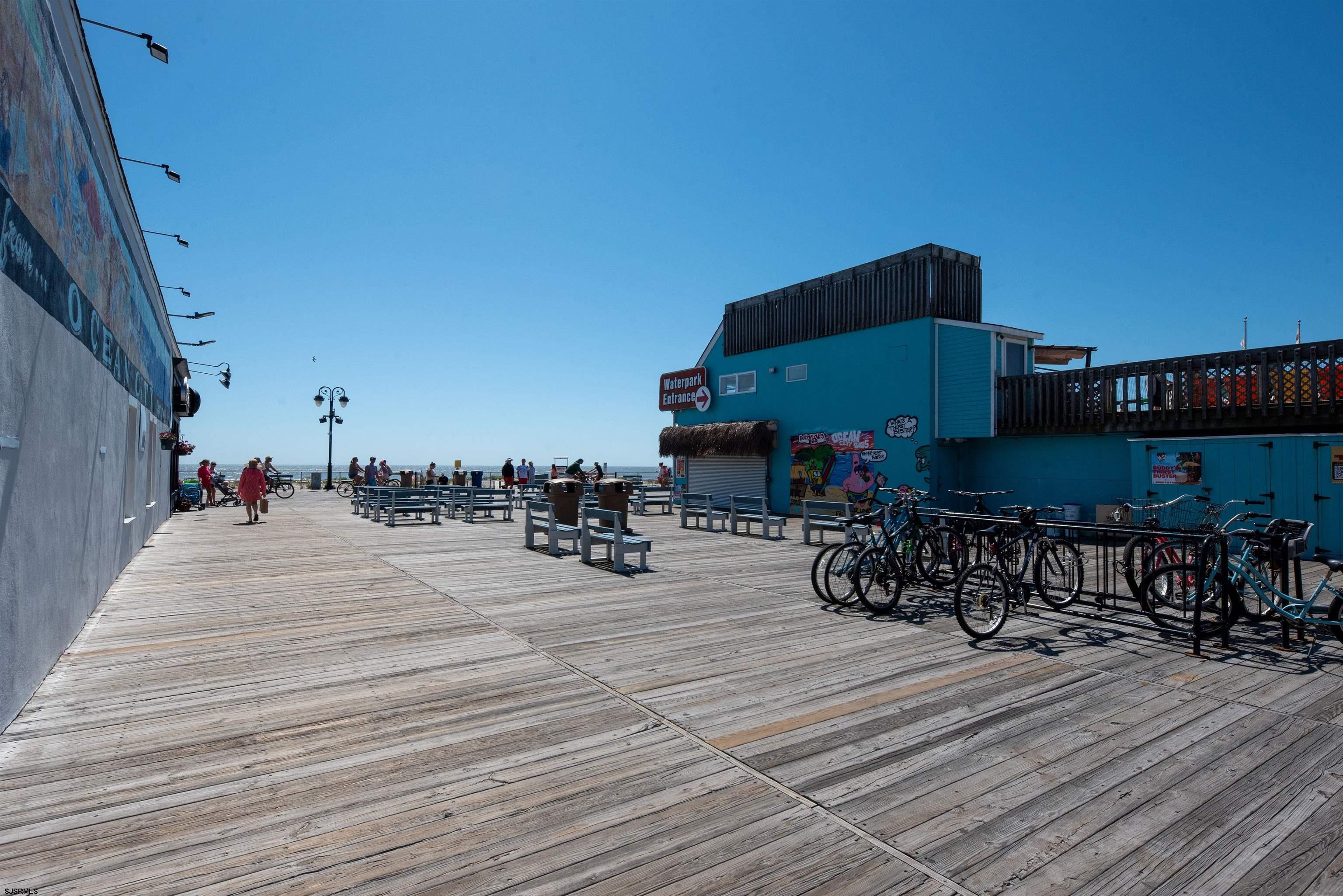 875 Plymouth Place, Unit 35 Ocean City, NJ 08226 - Photo 43 of 60 a terrace with outdoor seating and wooden floor