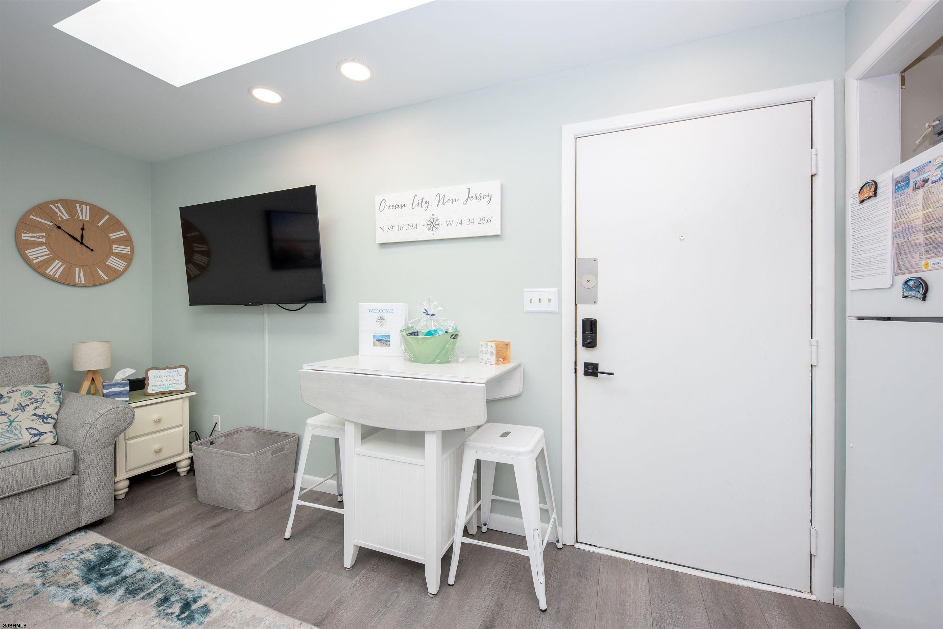 875 Plymouth Place, Unit 35 Ocean City, NJ 08226 - Photo 8 of 60 a view of a livingroom with furniture and a flat screen tv