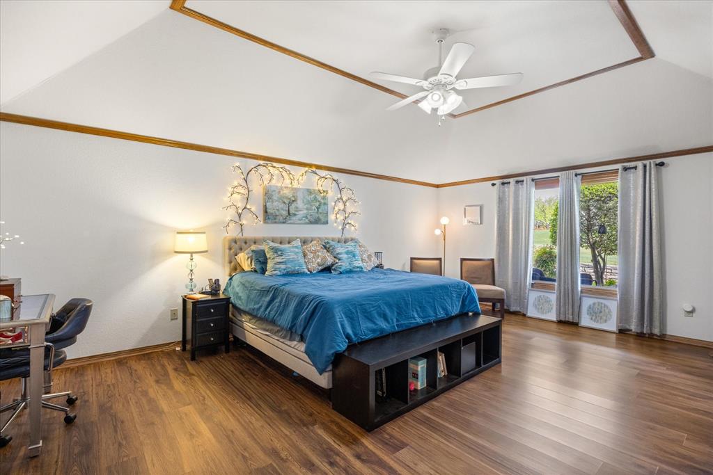 8911 Bontura Road Granbury, TX 76049 - Photo 24 of 39 Bedroom featuring dark wood finished floors, a desk, a ceiling fan, and vaulted ceiling