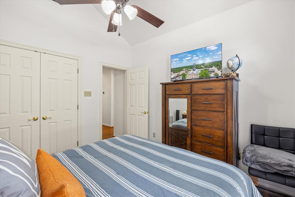 8911 Bontura Road Granbury, TX 76049 - Photo 28 of 39 Bedroom with a closet, lofted ceiling, and ceiling fan