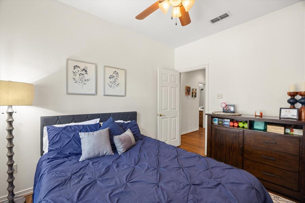 8911 Bontura Road Granbury, TX 76049 - Photo 30 of 39 Bedroom with a ceiling fan and dark wood-style floors