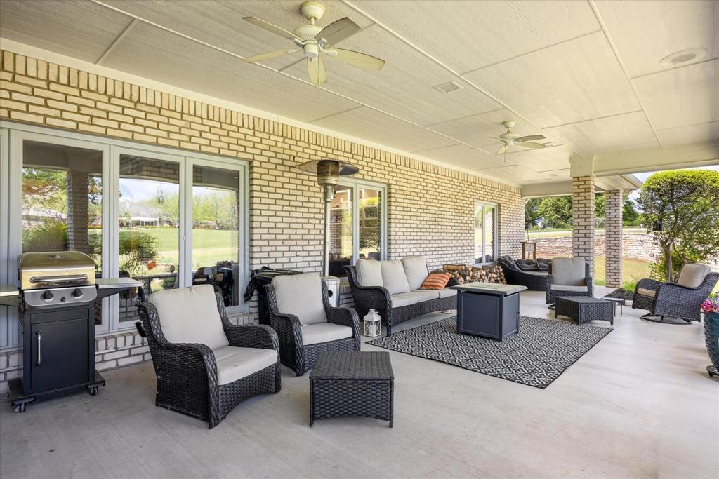 8911 Bontura Road Granbury, TX 76049 - Photo 31 of 39 View of patio / terrace with a ceiling fan, grilling area, and outdoor seating
