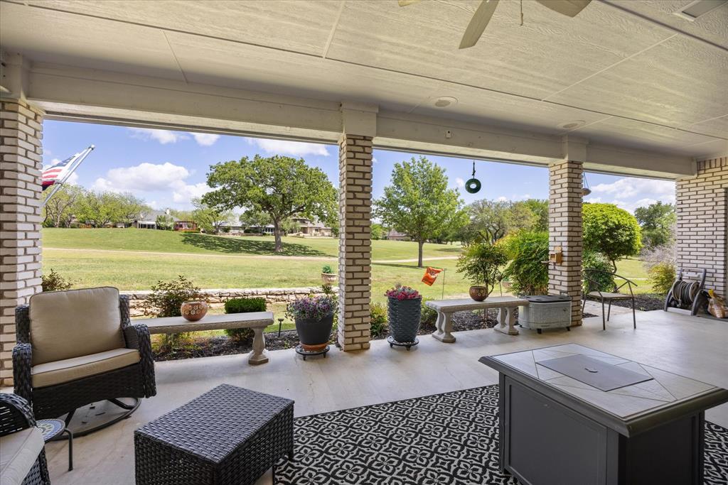 8911 Bontura Road Granbury, TX 76049 - Photo 32 of 39 View of patio / terrace featuring ceiling fan and view of golf course