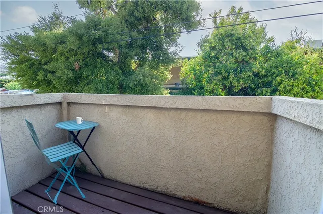 a view of balcony with furniture