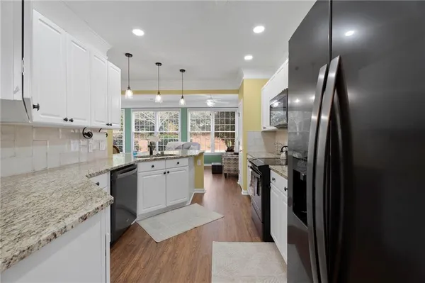 a kitchen with counter top space cabinets and stainless steel appliances