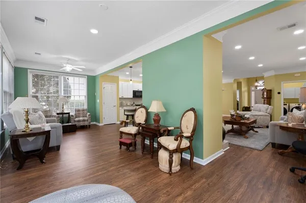 a living room with furniture or couch and a wooden floor