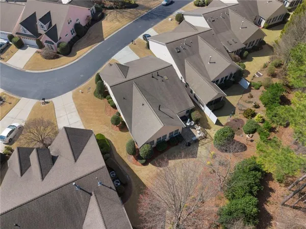 an aerial view of a house with a yard