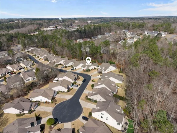 an aerial view of a house with yard swimming pool and outdoor seating