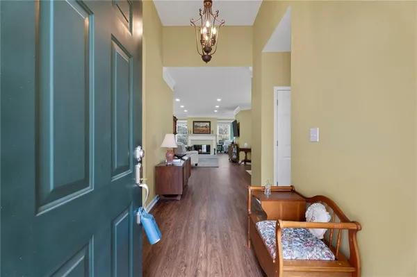 a view of living room with furniture and wooden floor