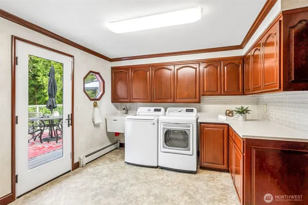 a utility room with dryer and washer