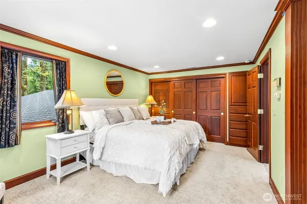 a bedroom with a bed and a dresser