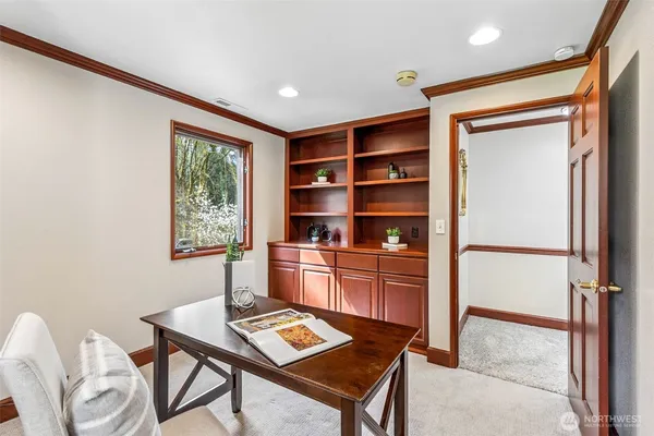 a workspace with furniture and window