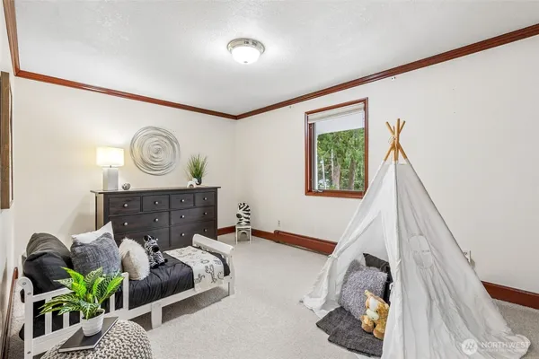 a bed room with furniture and a window