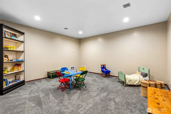 a living room with hard wood flooring