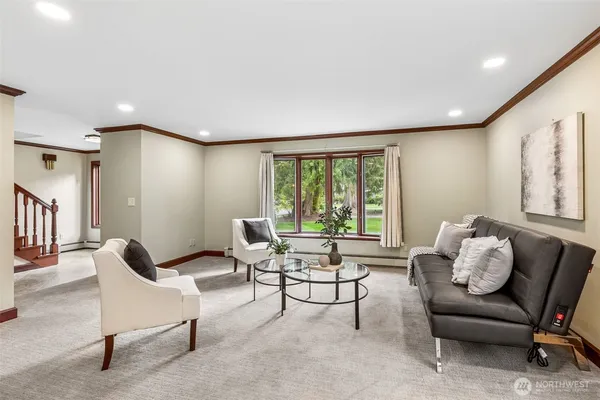 a living room with furniture and a large window