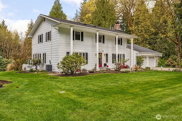a front view of house with yard and green space