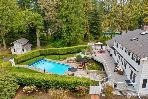 an aerial view of a house with a yard