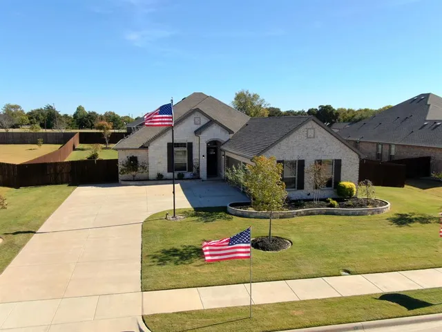 a view of house and outdoor space with swimming pool and furniture