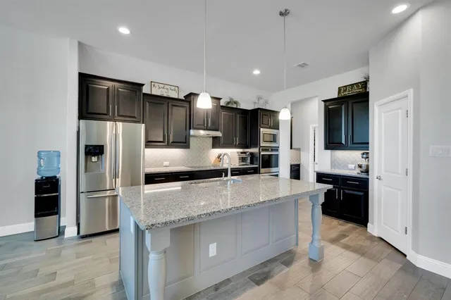 a view of a small space in front of house