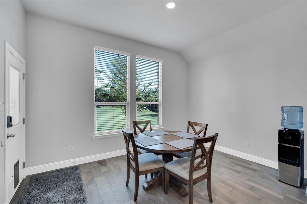 5642 Ranger Drive Midlothian, TX 76065 - Photo 15 of 40 a view of a dining room with furniture and wooden floor