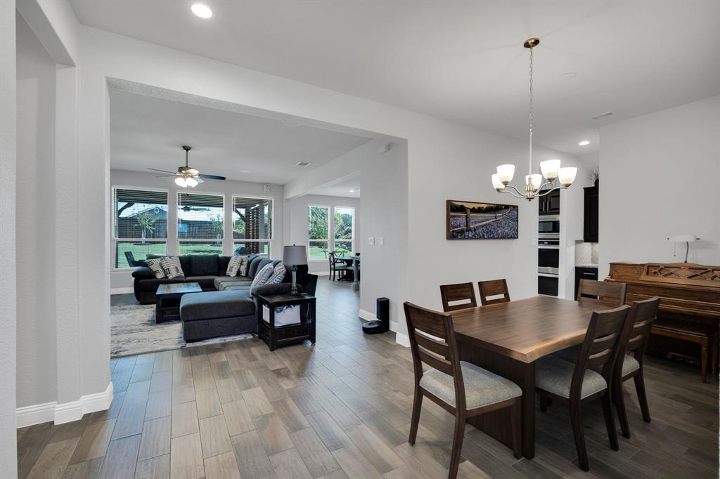 5642 Ranger Drive Midlothian, TX 76065 - Photo 17 of 40 a view of a dining room with furniture window and wooden floor