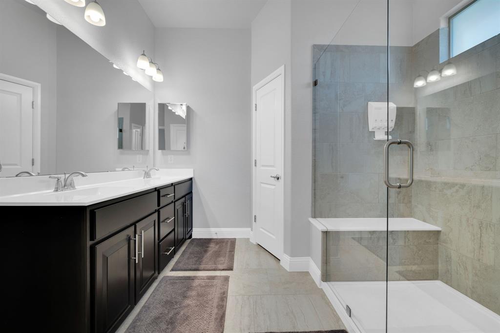5642 Ranger Drive Midlothian, TX 76065 - Photo 22 of 40 a bathroom with a double vanity sink and a mirror