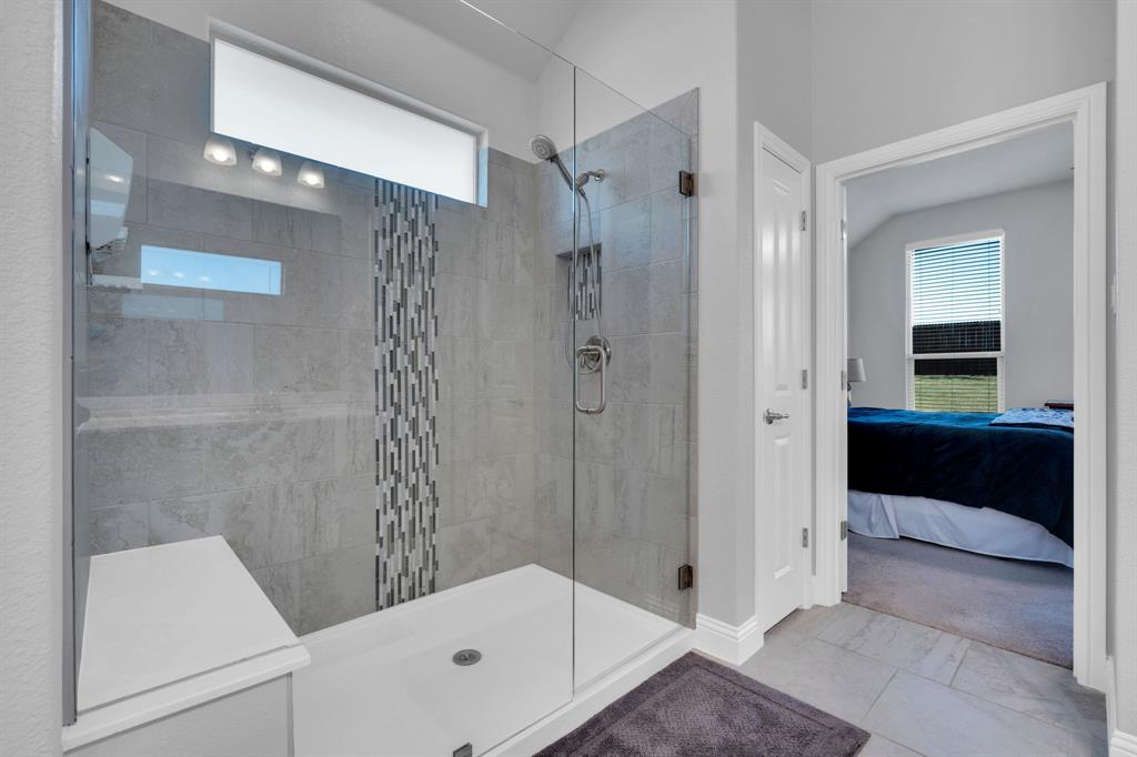 5642 Ranger Drive Midlothian, TX 76065 - Photo 23 of 40 a bathroom with a glass shower door