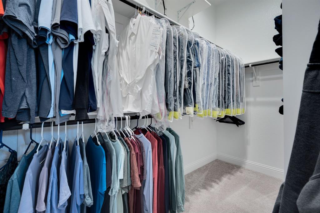 5642 Ranger Drive Midlothian, TX 76065 - Photo 25 of 40 a view of walk in closet with clothes