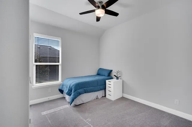 a view of walk in closet with clothes
