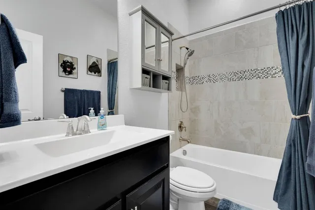 a living room with a bed furniture and a window