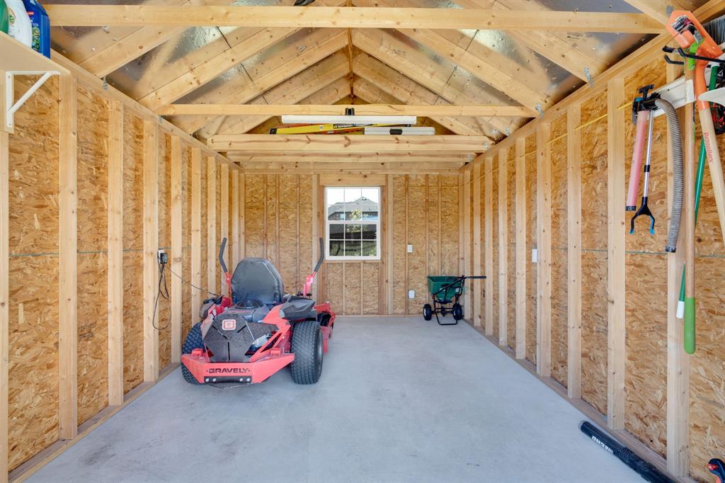 5642 Ranger Drive Midlothian, TX 76065 - Photo 32 of 40 a living room with furniture and a chandelier