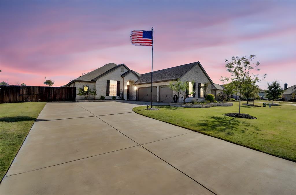 5642 Ranger Drive Midlothian, TX 76065 - Photo 9 of 40 a front view of a house with a yard