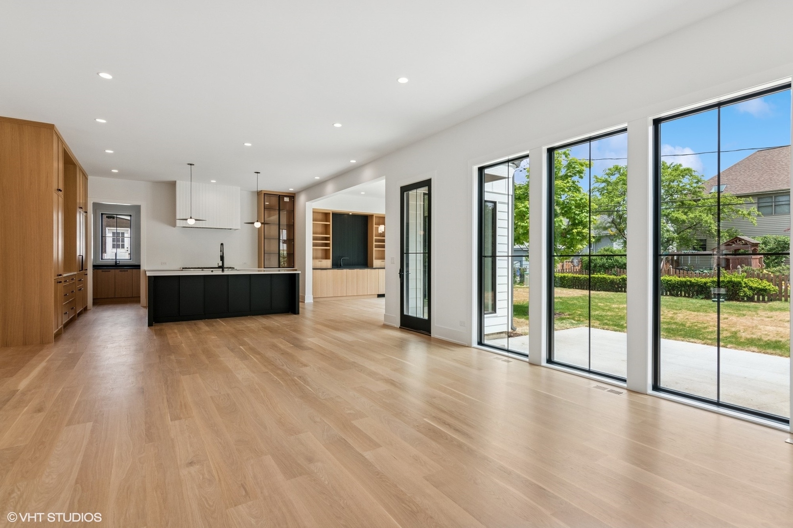613 Chatham Avenue Elmhurst, IL 60126 - Photo 14 of 37 a view of a big room with wooden floor and windows